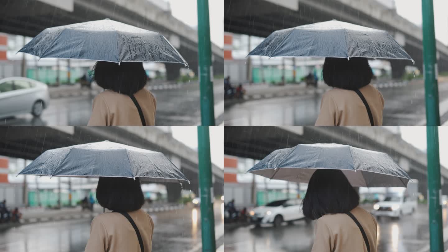 亚洲女人在雨里等出租车