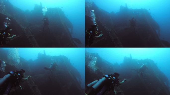 人们在海洋中探索沉船的4k视频片段