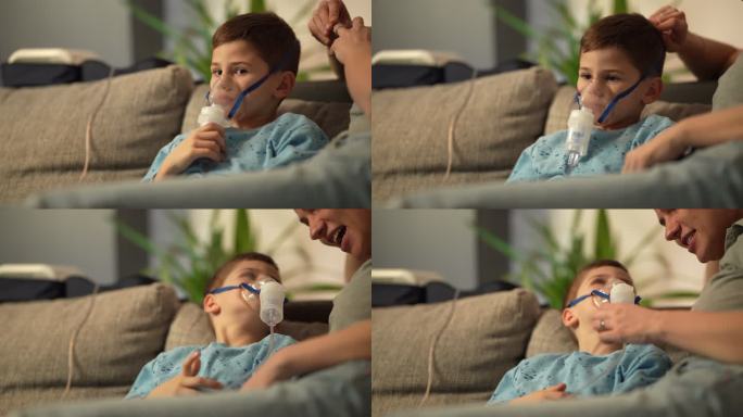 小男孩正在吸气医用设备感冒治疗生病病人