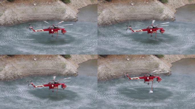加州野火的4K视频，一只空中起重机在水库上取水