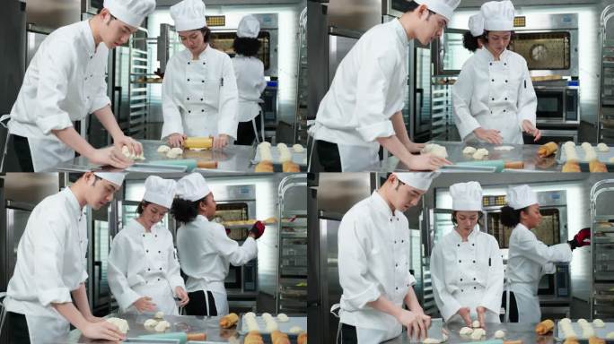 穿着白色厨师制服的多种族年轻面包师在商业厨房一起制作面包、面包和法式面包。他们称重、分割、揉捏、成型