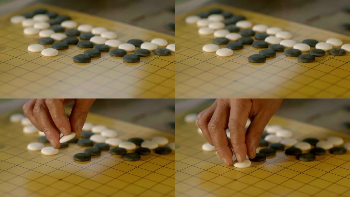 围棋 落子 棋盘 老人的手 白子