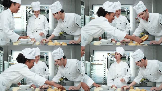 穿着白色厨师制服的亚洲和非洲年轻厨师一起工作，制作面包和面包，在烤箱中进行打样和烘焙之前进行揉捏和成