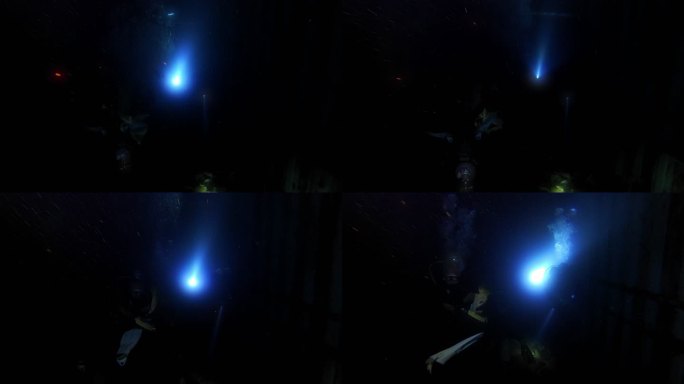 探索红海著名的潜水点。潜水员正在驶入塞勒姆特快船失事。手电筒在黑暗的船内反射