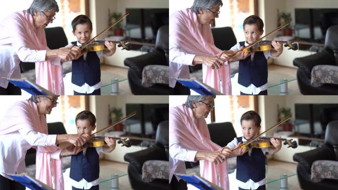 高级小提琴老师教一个小男孩拉小提琴
