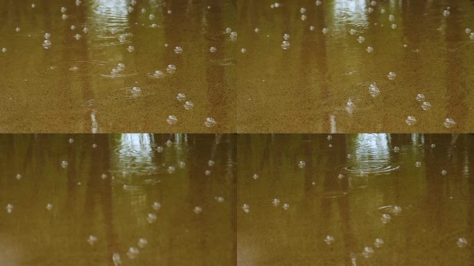下雨雨滴落在水里起水泡升格拍摄