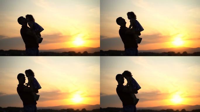 日落时分，父亲抱着他的小女儿