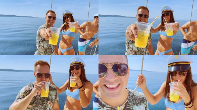 男男女女在游艇上喝着鸡尾酒欢呼，对着镜头微笑