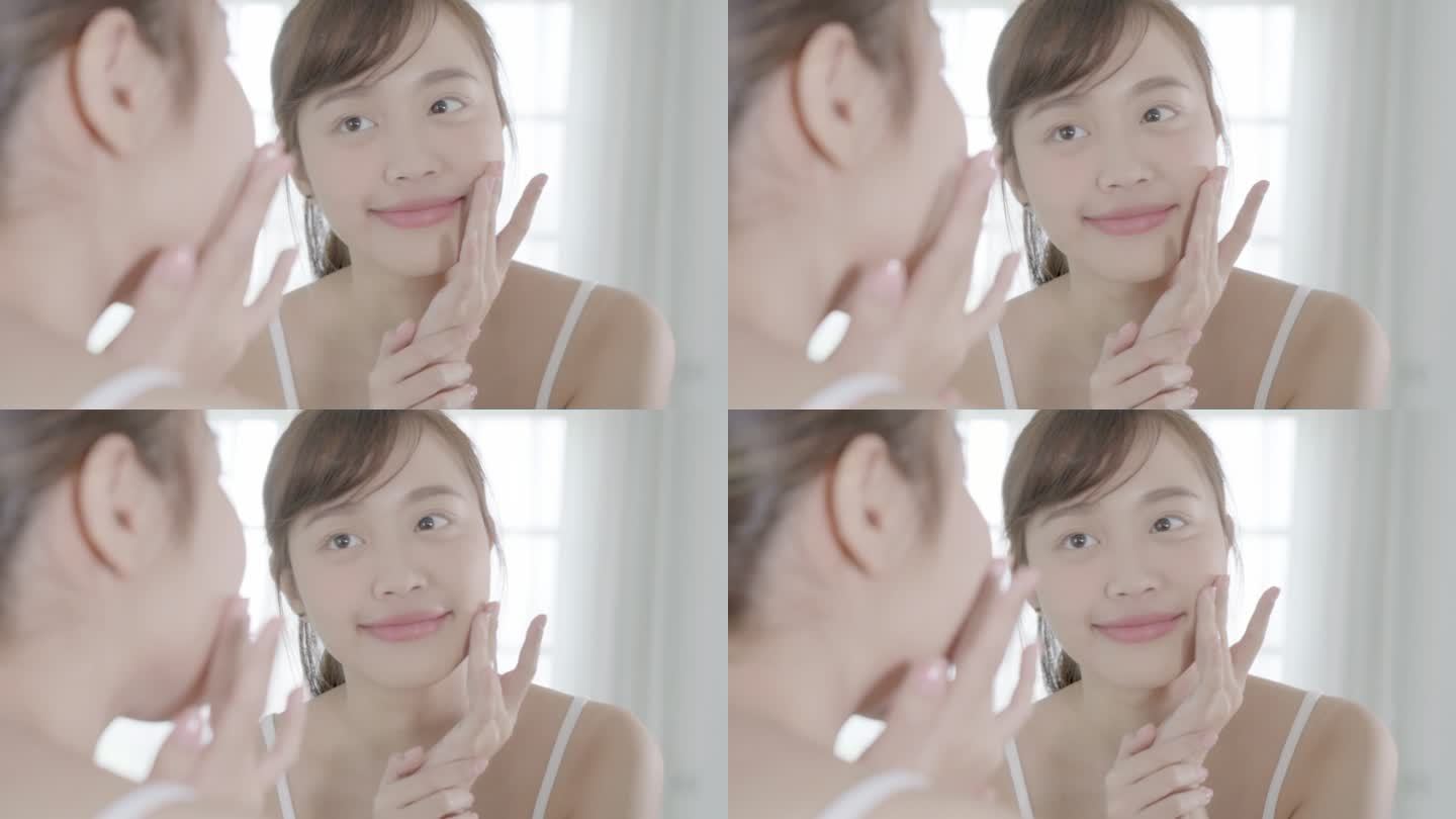 美丽的亚洲年轻女性乐于在面部涂抹润肤霜或润肤乳，美丽的亚洲女孩使用护肤品来接触面部化妆，健康和健康理