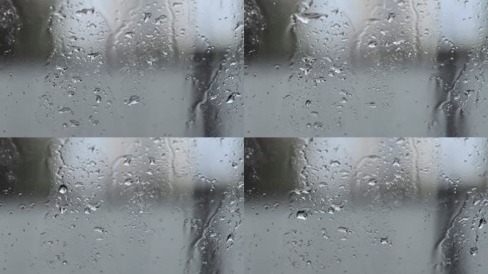 下雨天的窗户流动的雨滴