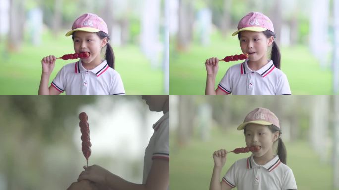 小女孩吃冰糖葫芦