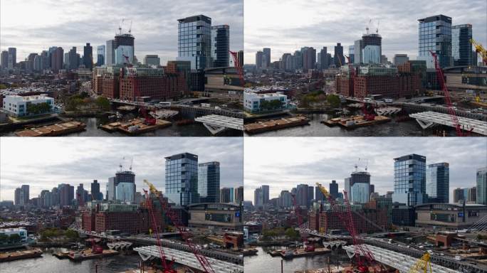 波士顿市中心附近的查尔斯河（Charles River），可以看到现代化的公寓和办公楼，以及在建的新