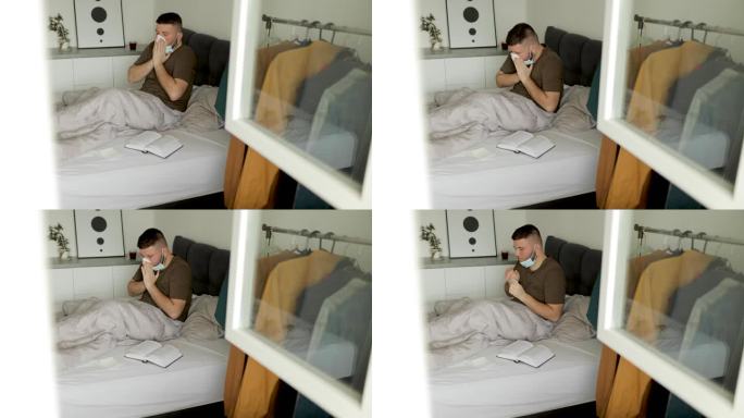 一张年轻男子生病并在床上用纸巾擤鼻子的照片