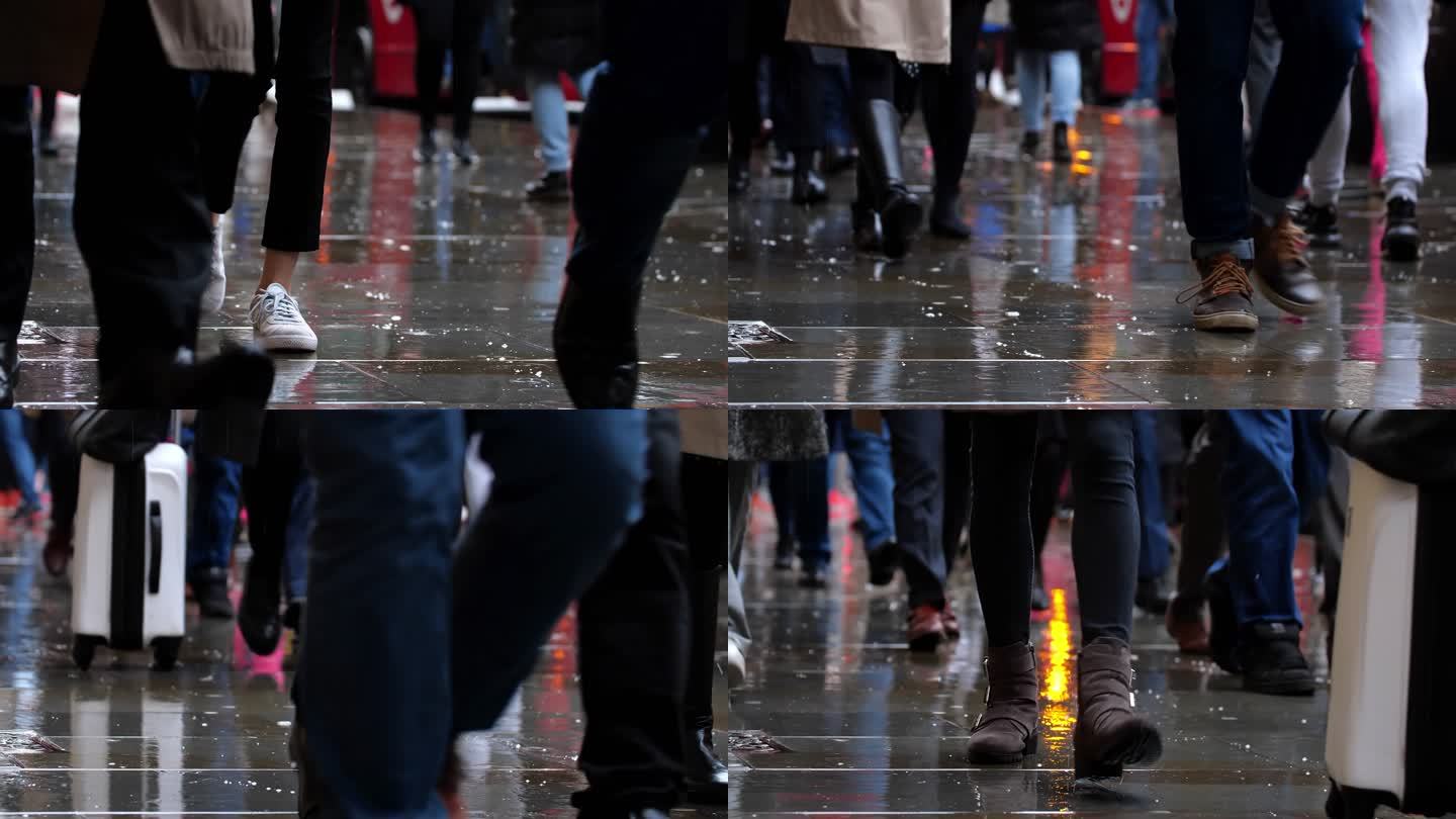 雨中城市通勤者的低角度视图。