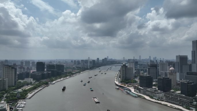 航拍上海城市黄浦江边货船漂泊