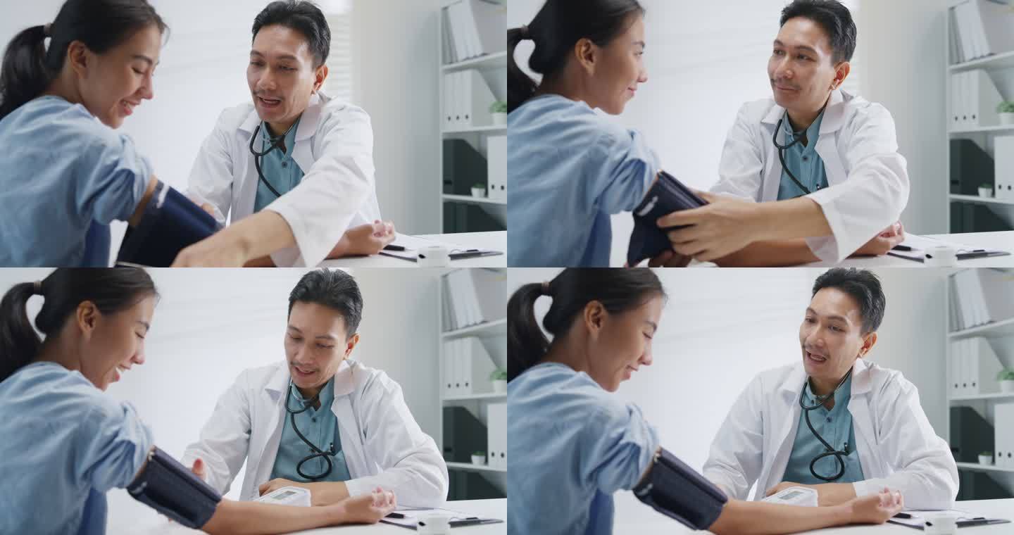 成熟的亚洲男性医生在健康诊所测量女性患者的高低压。