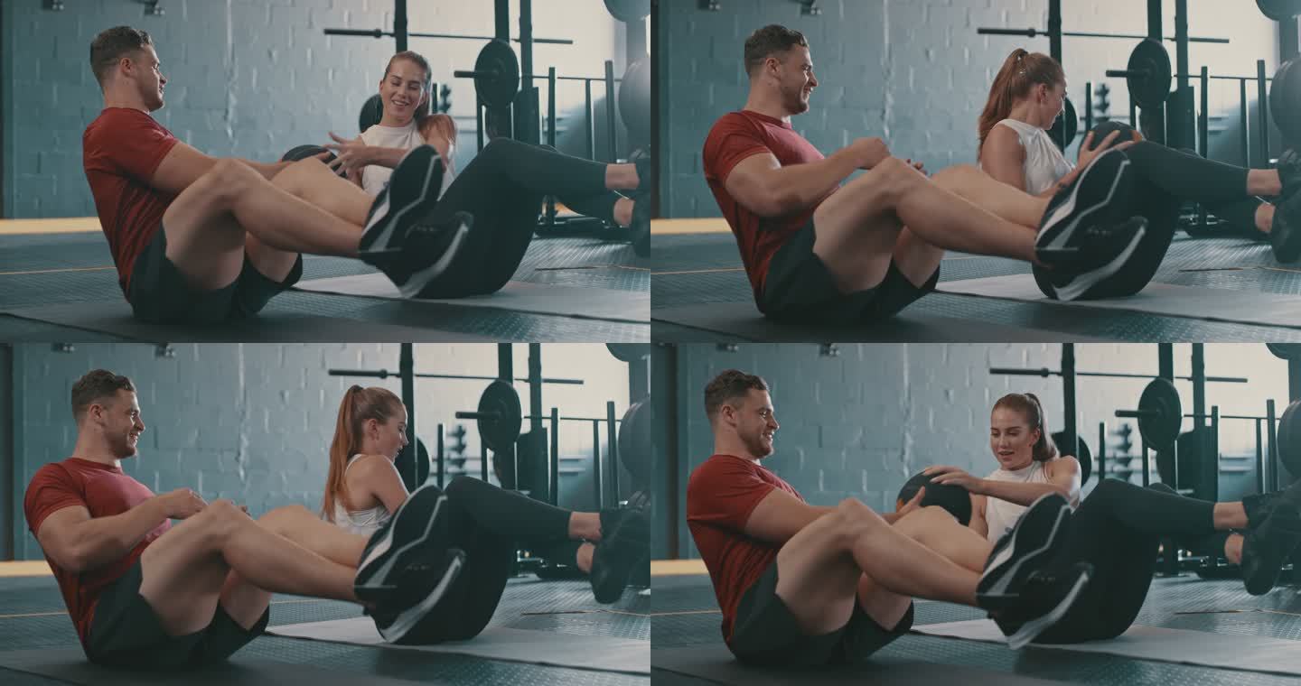 4k视频片段，一对年轻男女在健身房里用健身球做俄罗斯扭转动作