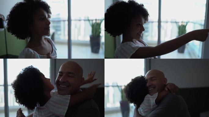 女儿在家里与聋哑父亲交谈并拥抱他