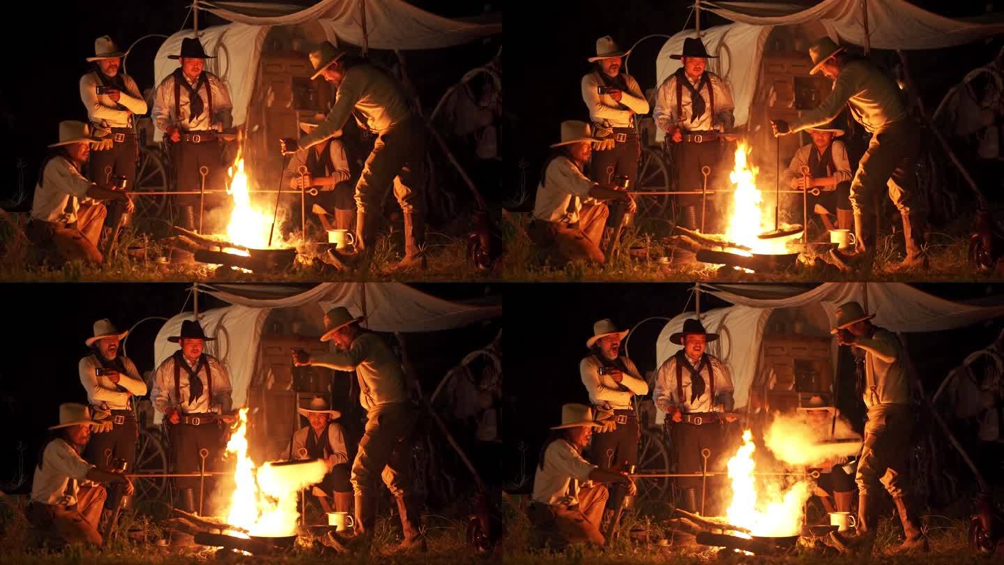 牛仔在篝火上做饭外国人露营篝火烧烤
