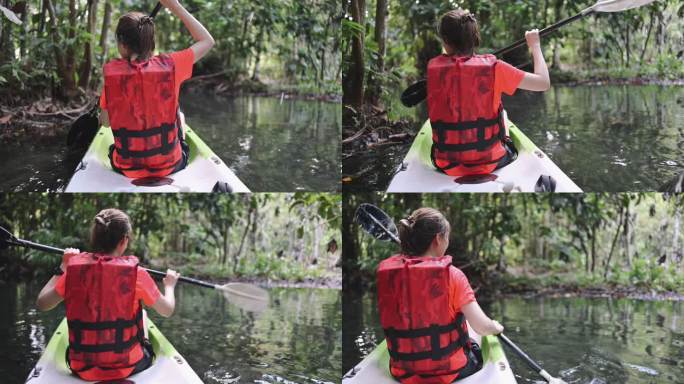 泰国克拉比省，一位亚洲女性在天然清澈的溪流中享受皮划艇运动。