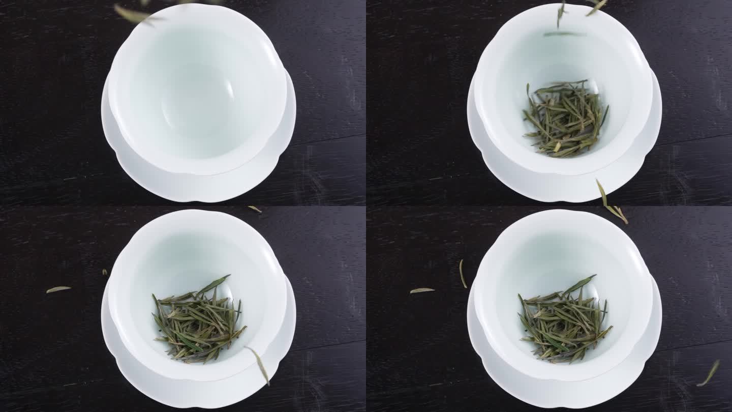 将绿茶叶放入陶瓷茶杯