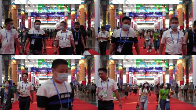 南宁国际会展中心东博会手提大包小包的人们