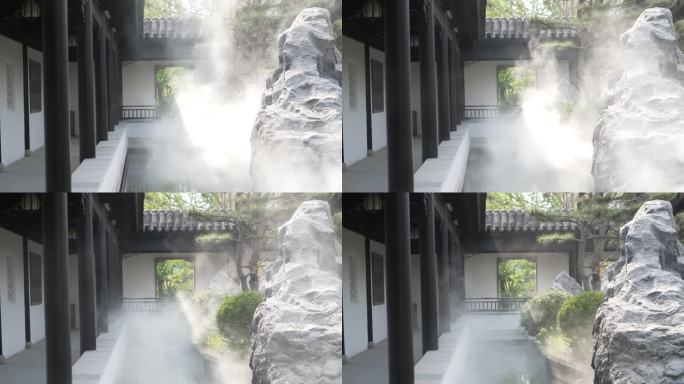 中式合院院子内烟雾升腾的景观池和连廊