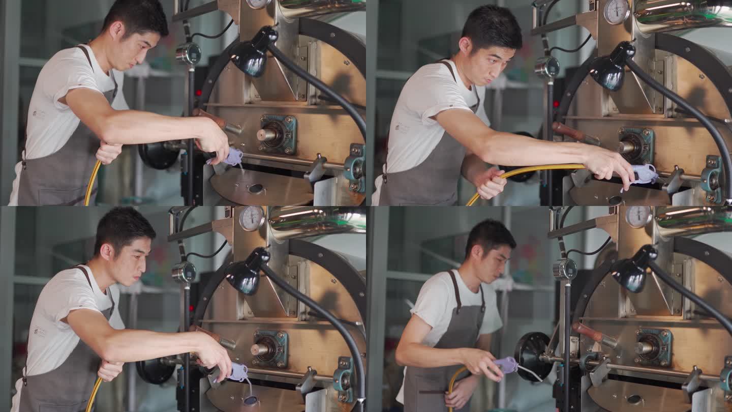 亚裔中国工人，带手套吹洗和清洁咖啡烘焙机，带真空清洁鼓风机