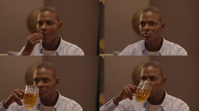 非州男人黑人吃东西熬夜喝啤酒吃零食爆米花