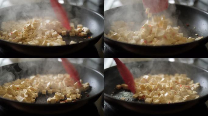 用豆腐丁炒大蒜和切碎的红辣椒