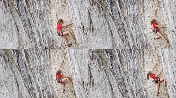 穿着红色衬衫的女性攀登者攀登悬崖