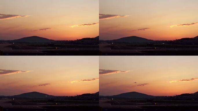日落余晖机场上空大燕飞翔与飞向空中的飞机