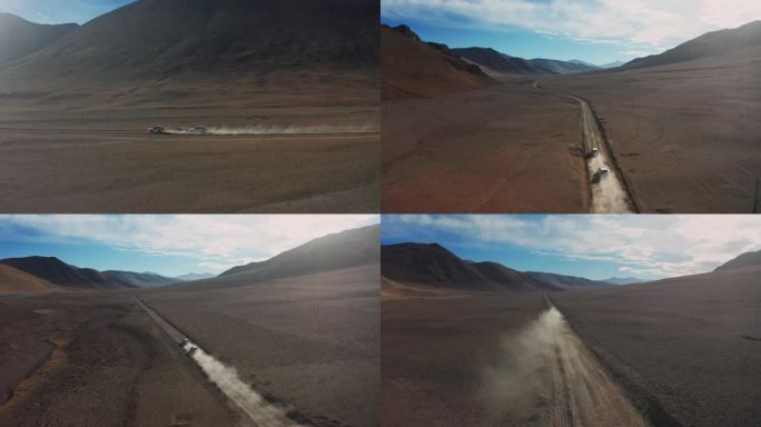 航拍越野车行驶在西藏阿里无人区的荒漠中