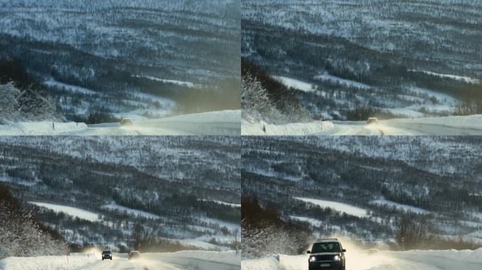 行驶在北欧雪山下的沥青公路