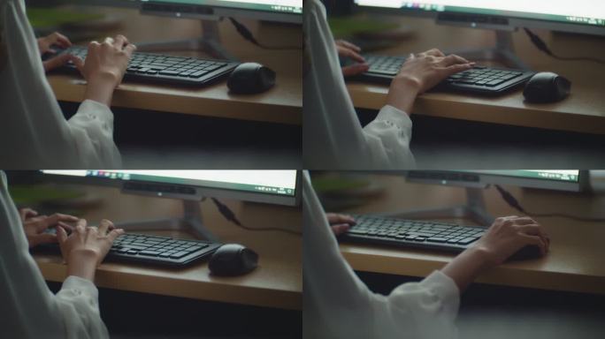 手特写：女商人在电脑键盘上打字