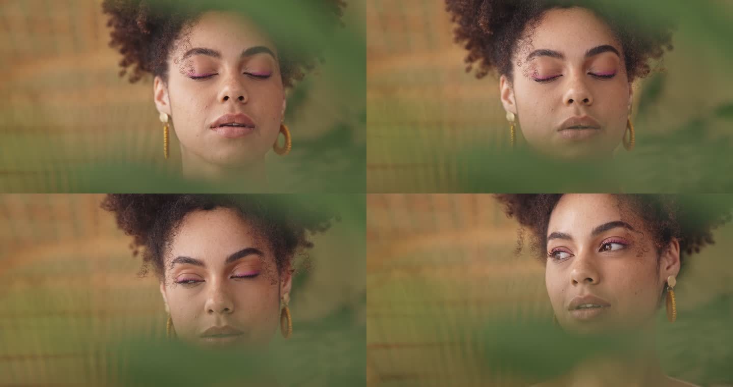 特写镜头：一位美丽的拉美裔女性，一位非洲黑人在一棵绿色植物后面的工作室里摆姿势。美丽的异国情调混血女