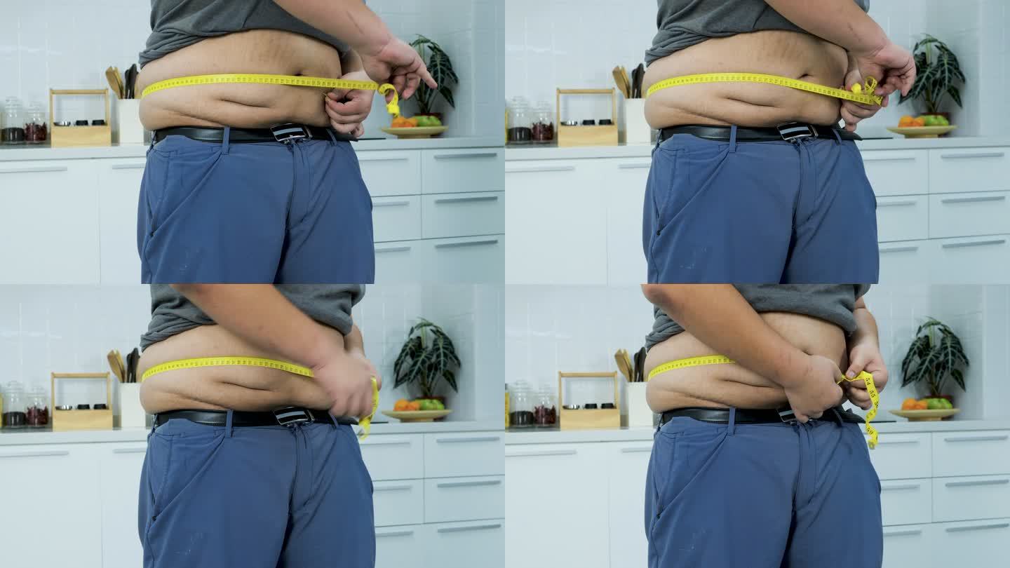男子测量大型建筑肥胖腰围测量