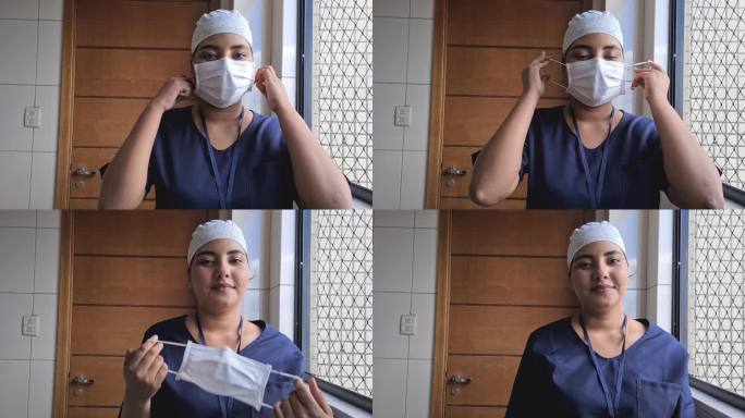 女医生或护士摘下防护面罩的肖像