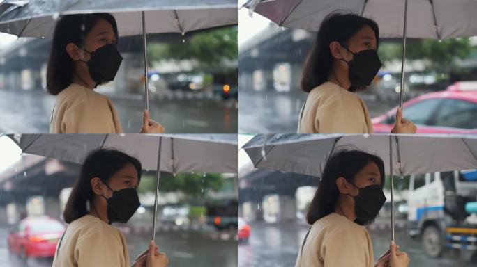 在雨中等待出租车的亚洲女性