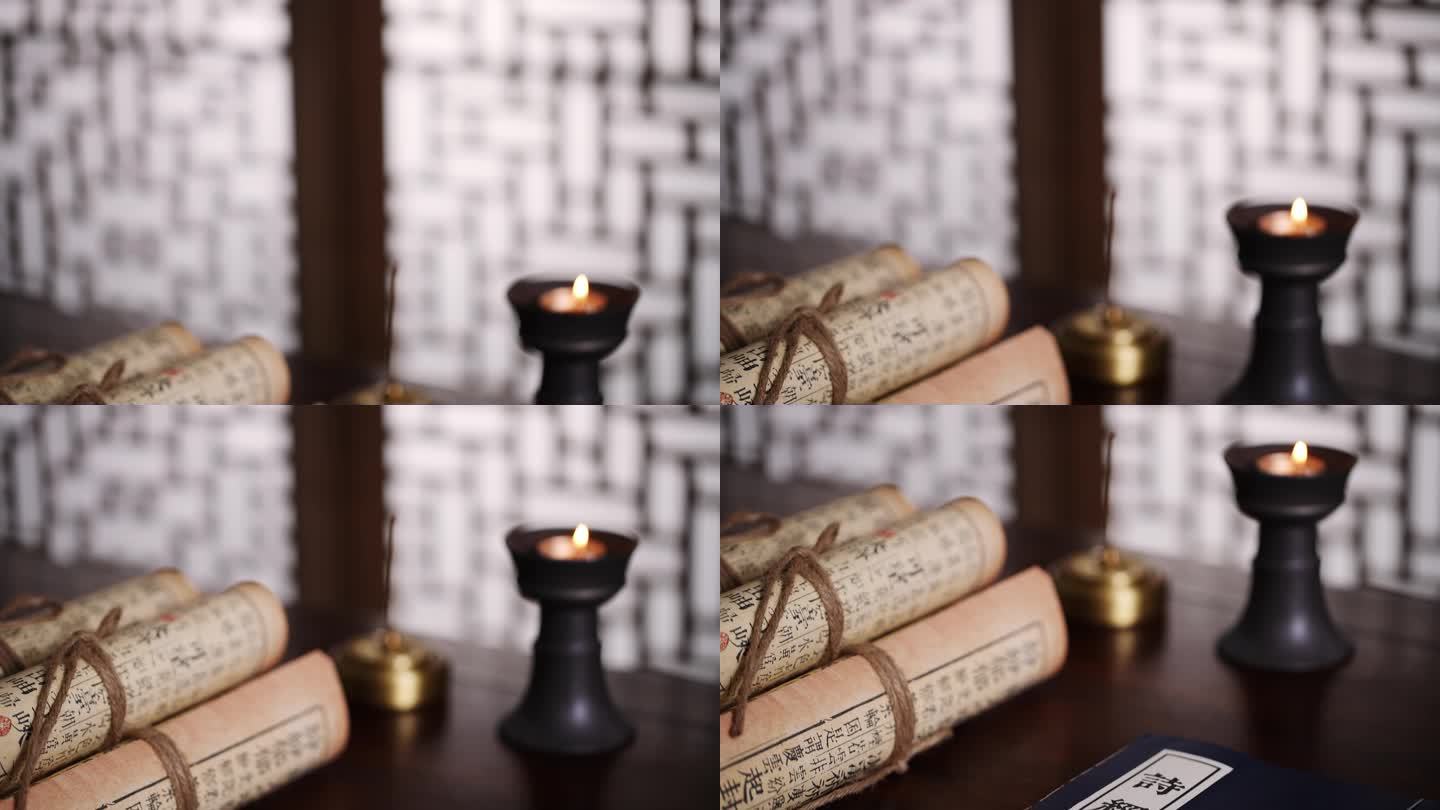 古代书房书桌上燃烧的蜡烛和古书诗经