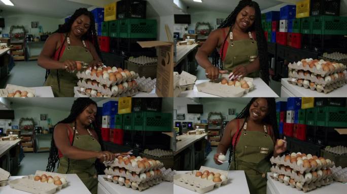 科罗拉多州当地一家小型商业农场，一位快乐的非裔美国妇女，长着时尚的指甲，正在打包新鲜的农场鸡蛋，准备