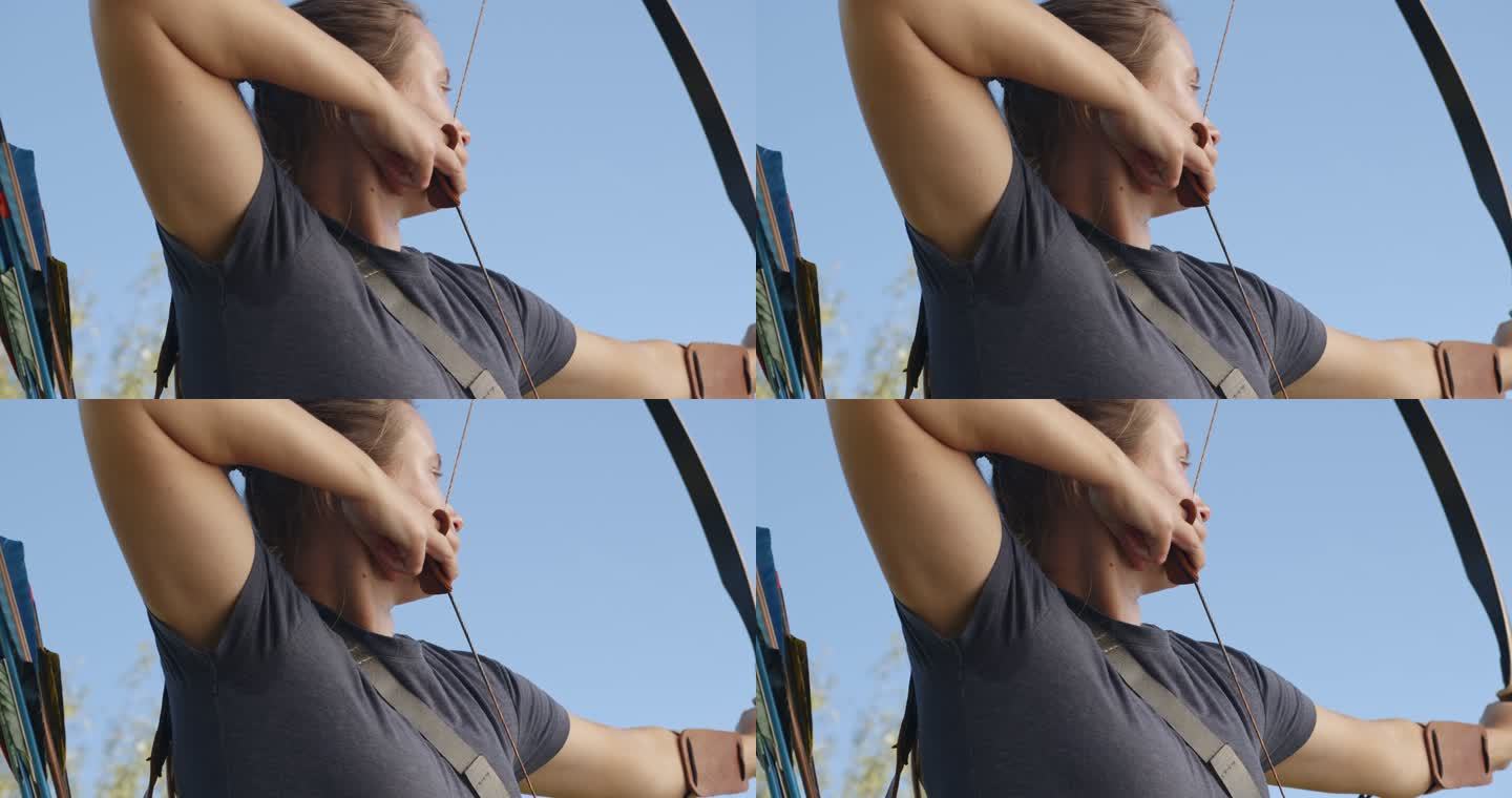 一名年轻女子射箭运动员在射箭场练习射箭的4k视频片段