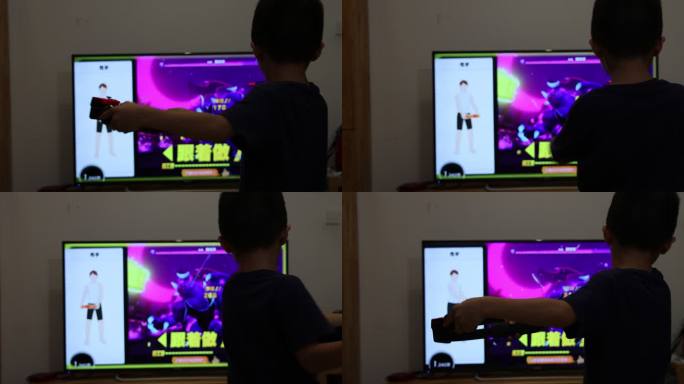 小男孩正在用体感游戏机玩健身游戏