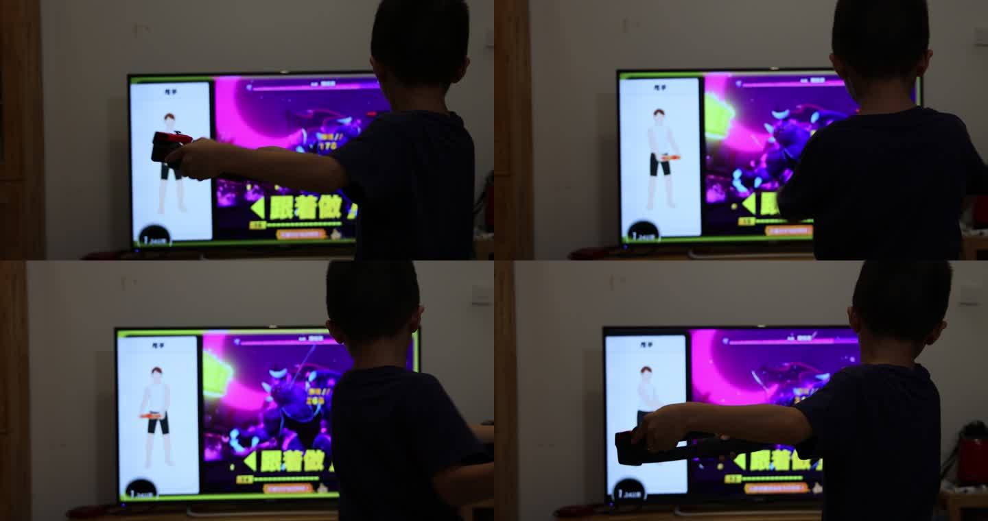 小男孩正在用体感游戏机玩健身游戏