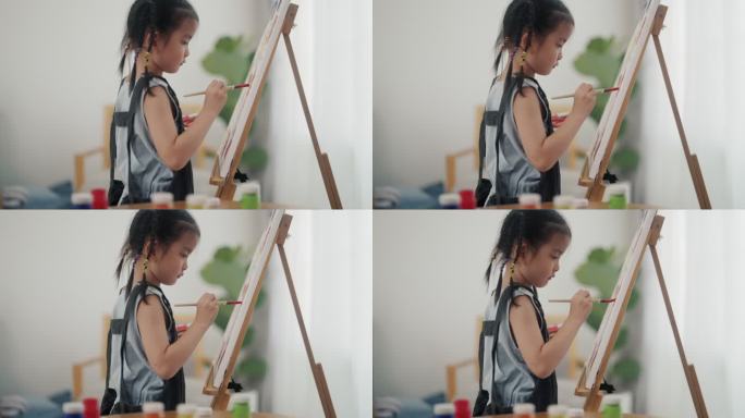 小艺术家在画板上画画的女孩兴趣培养热爱画