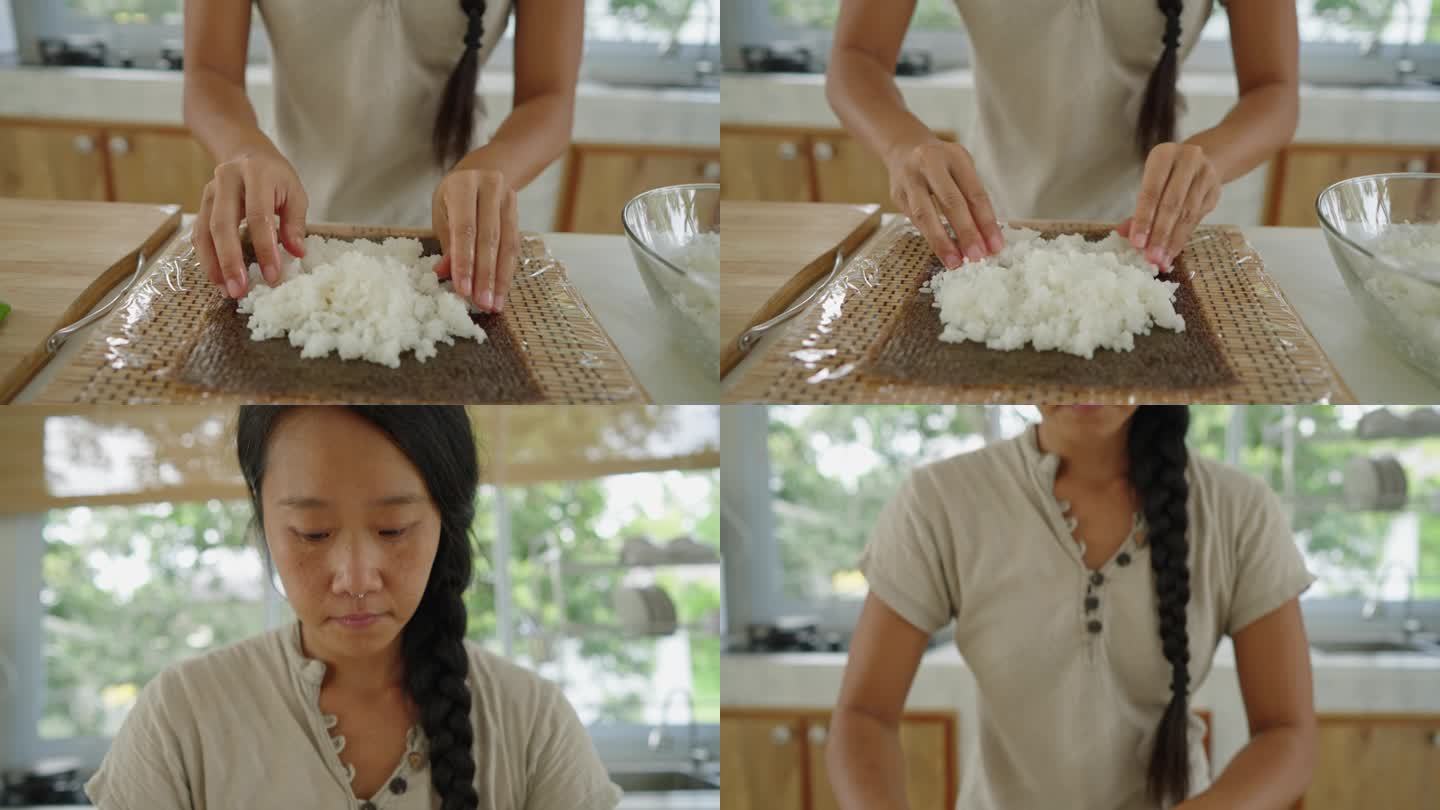 日本女性将大米涂在海藻纸上