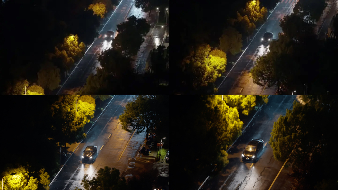 暴雨大风中的城市夜晚，汽车驶过雨中的道路