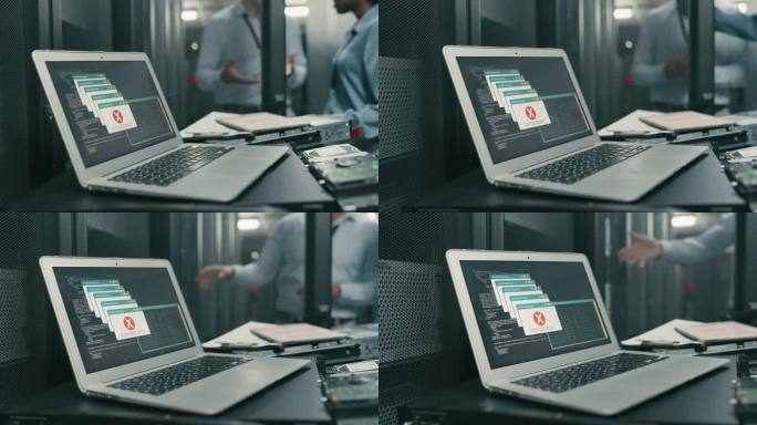 服务器机房笔记本电脑出错的4k视频片段，两位同事在后台交谈