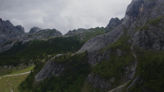 航拍山地平原五彩经幡