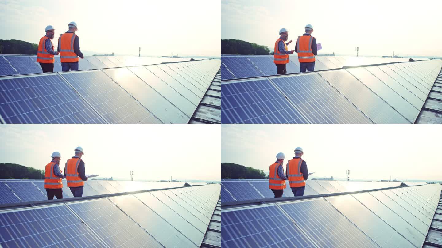 DS两名工程师在屋顶光伏电站上行走并交谈